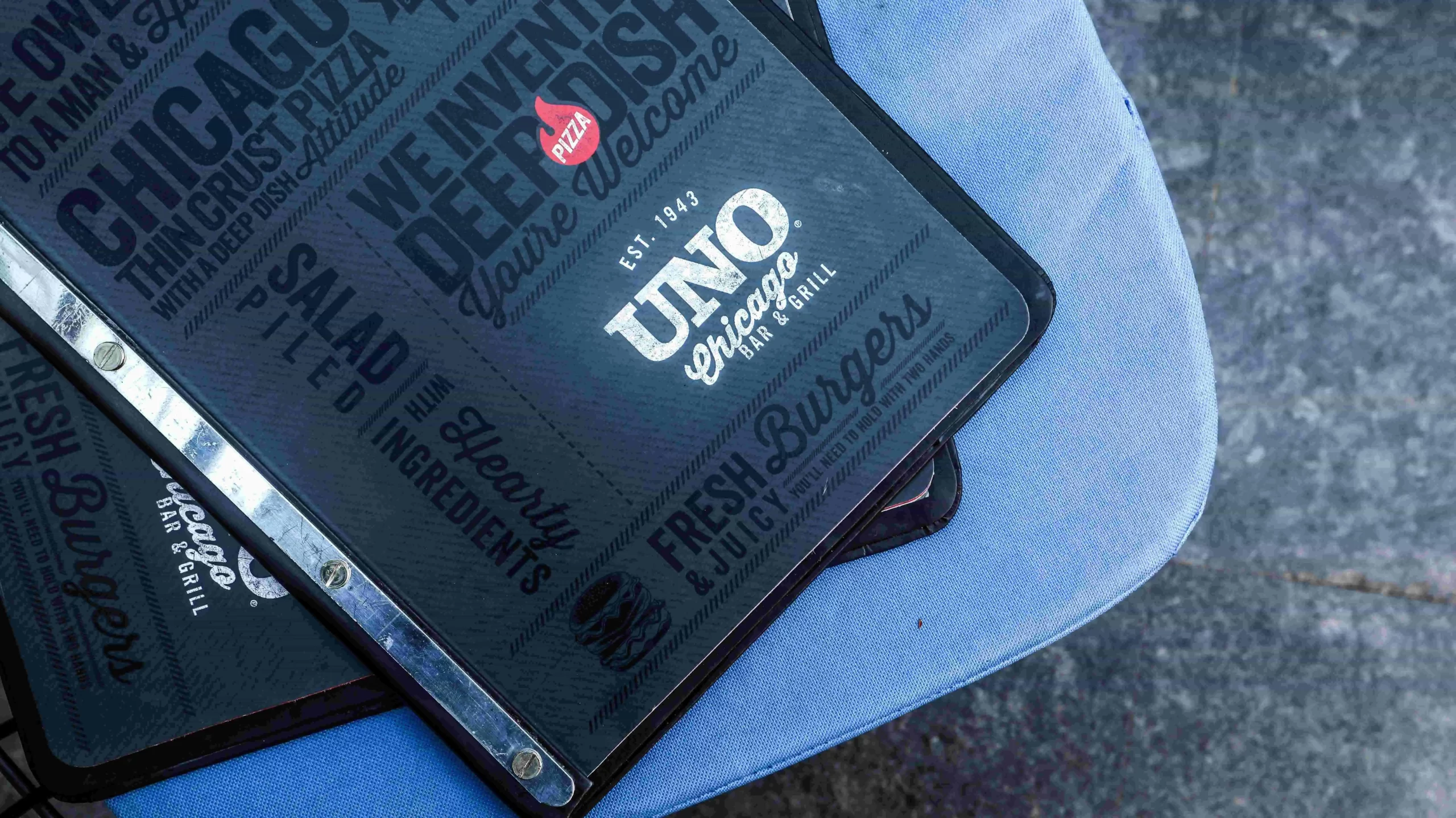 A black folder with the word 'uno' on it.