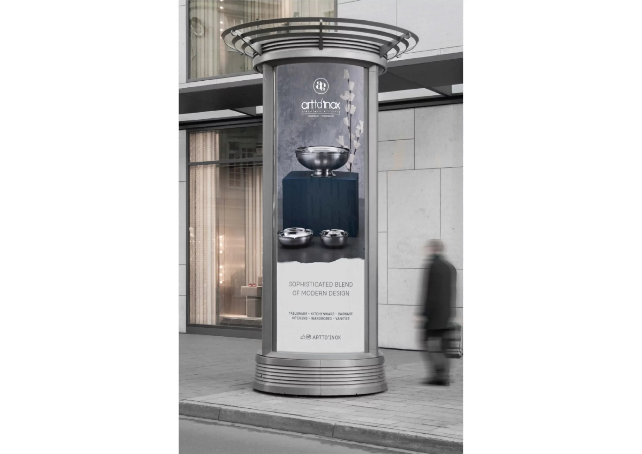 An advertisement for mercedes benz on a pole in front of a building.