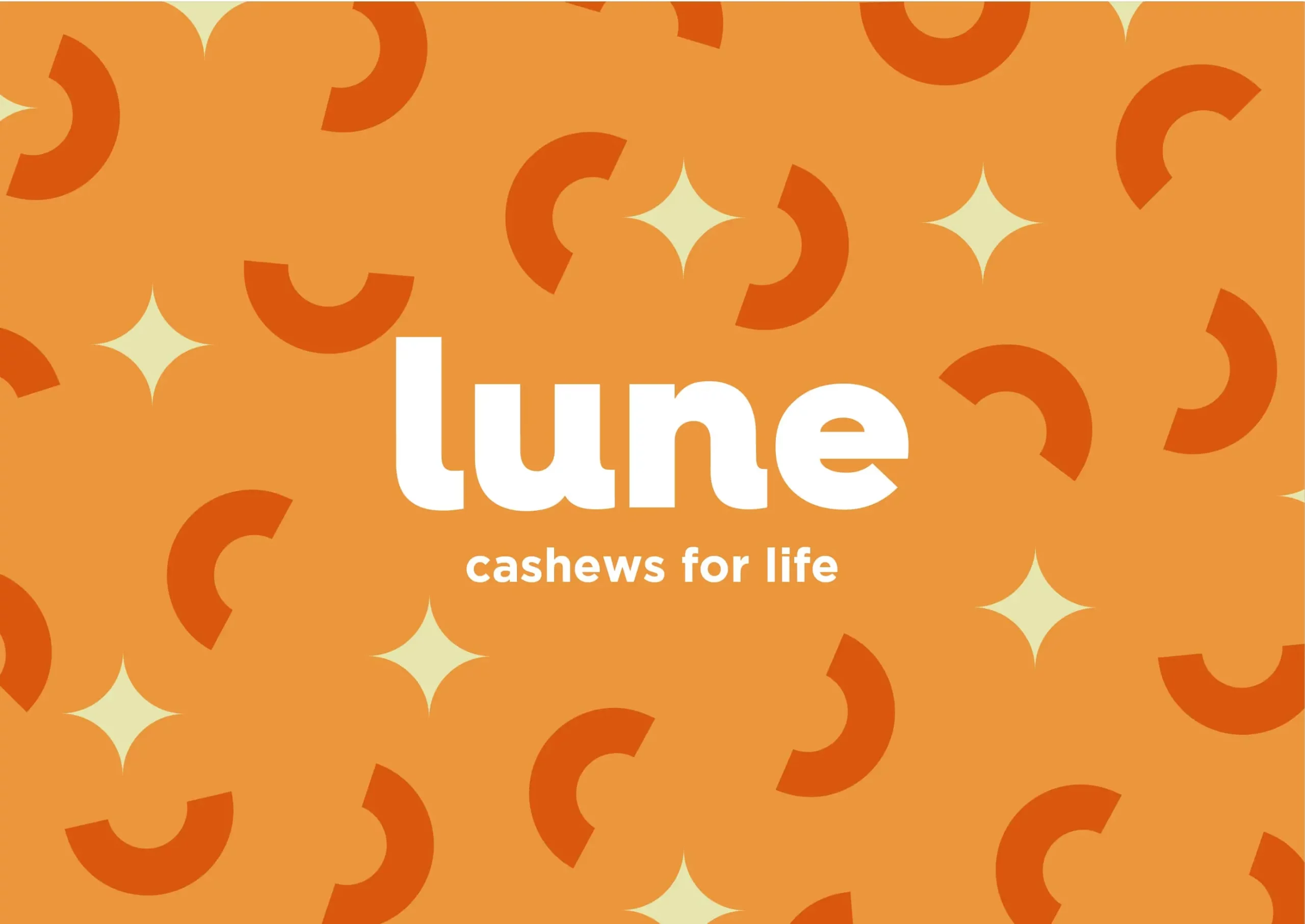 An orange background with the words lune cashews for life.