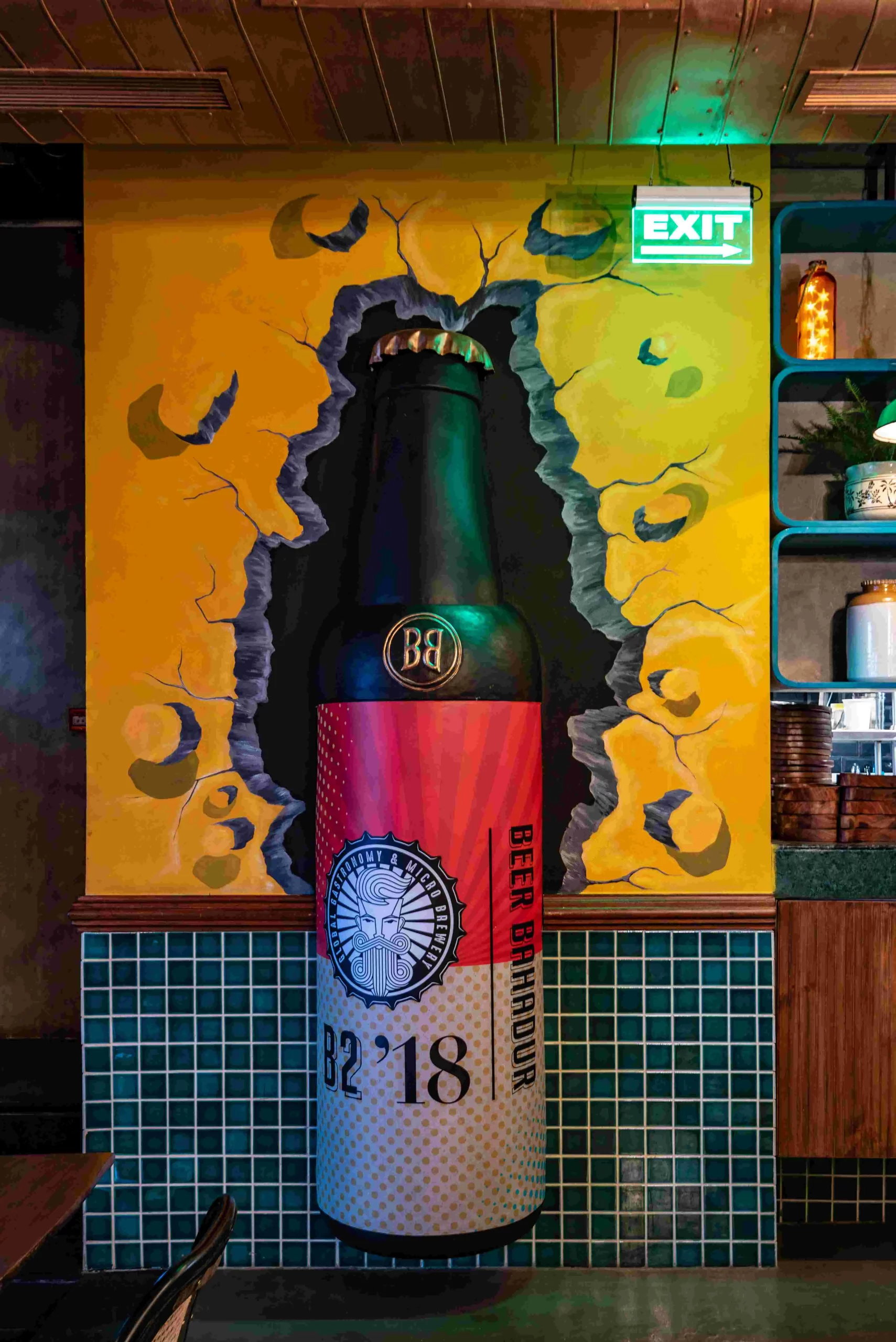 A beer bottle is painted on the wall of a restaurant.