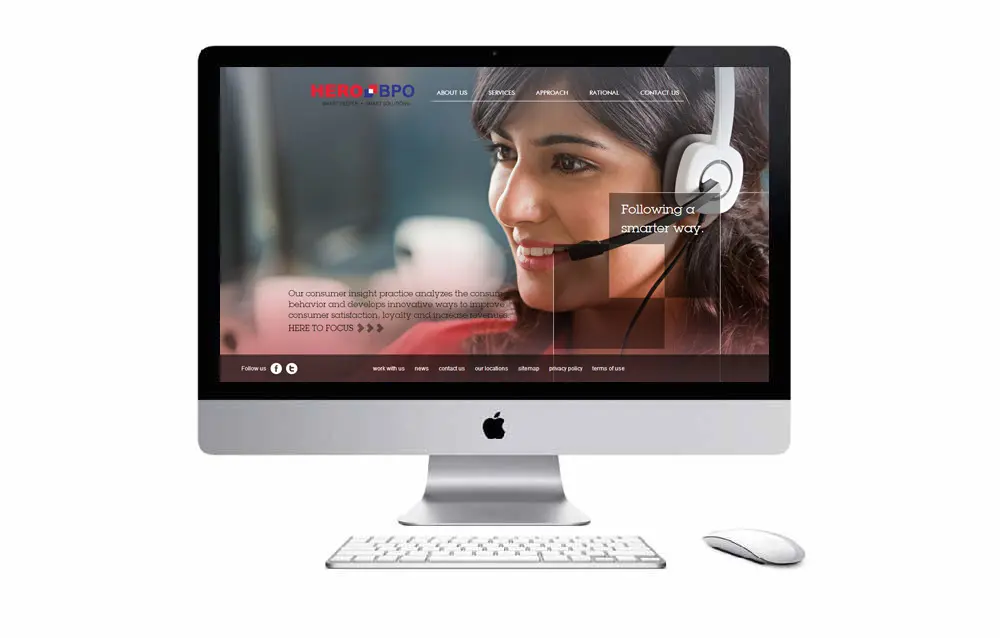 A computer screen with a woman wearing a headset.