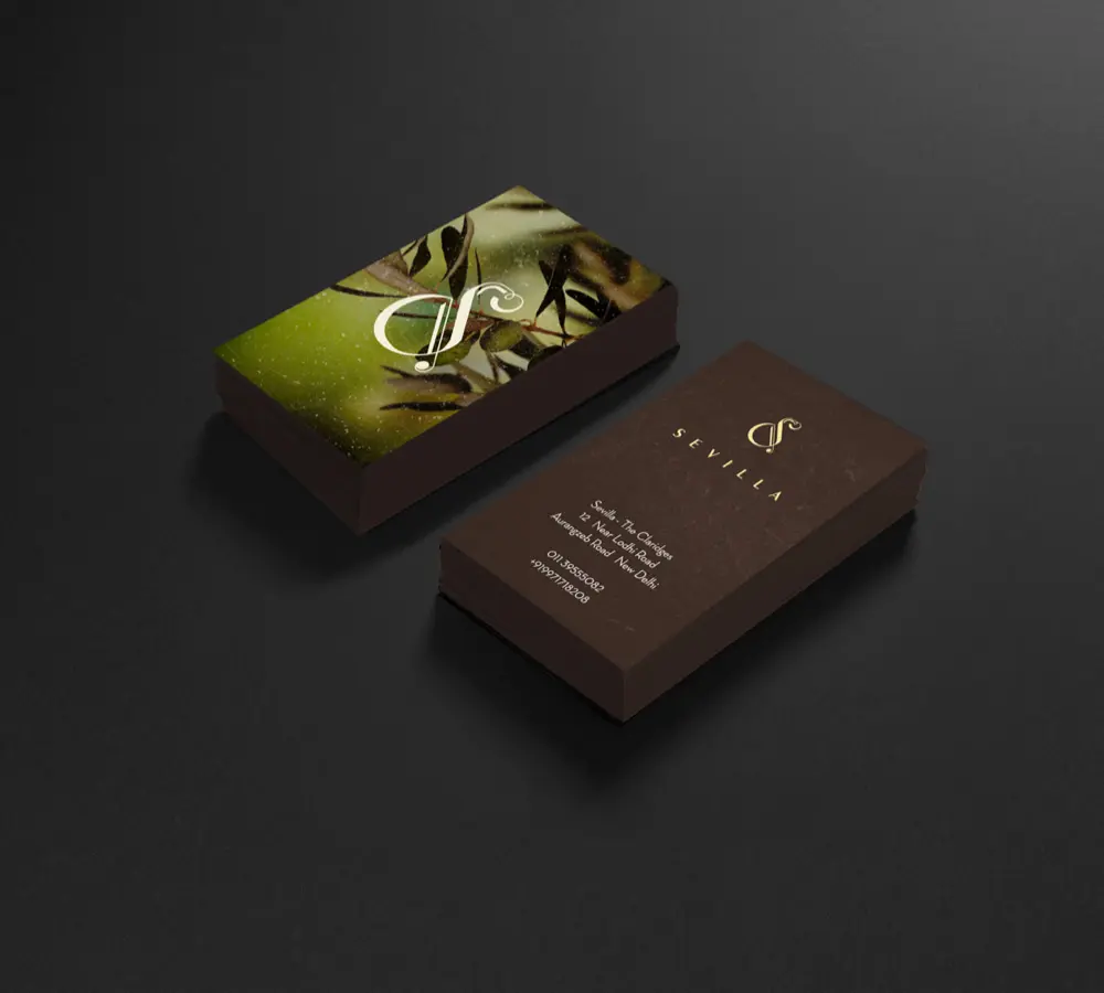 A business card with an olive tree on it.