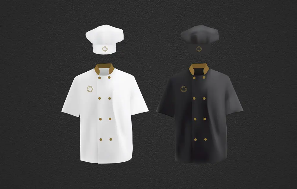 Two chef uniforms on a black background.