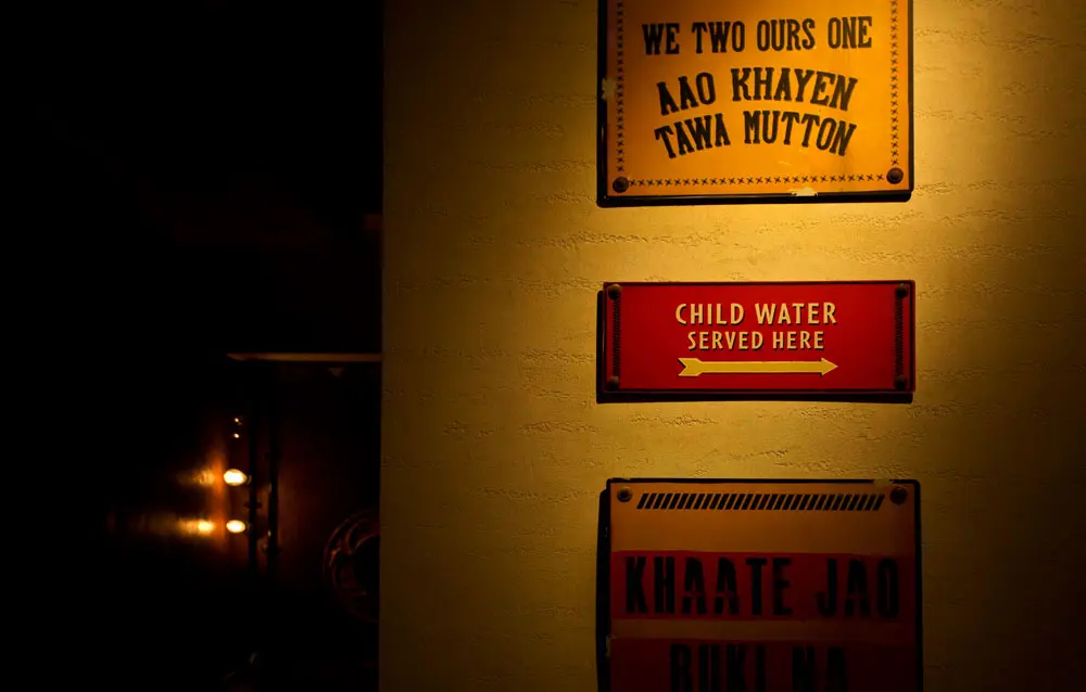Karate signs hanging on a wall.