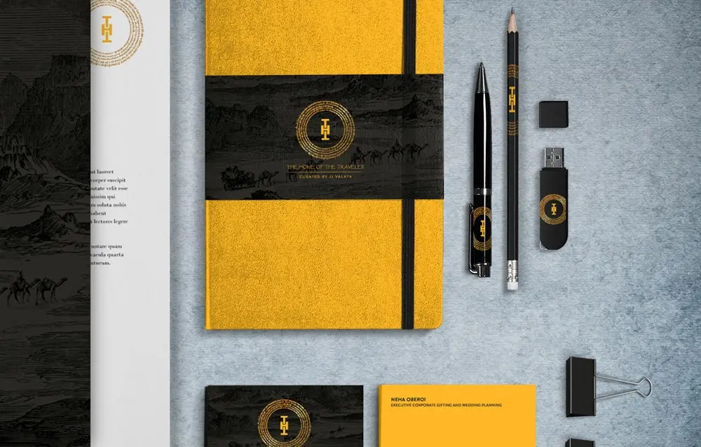 A yellow and black stationery set with pens and pencils.