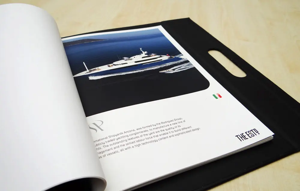 An open book with a picture of a boat.