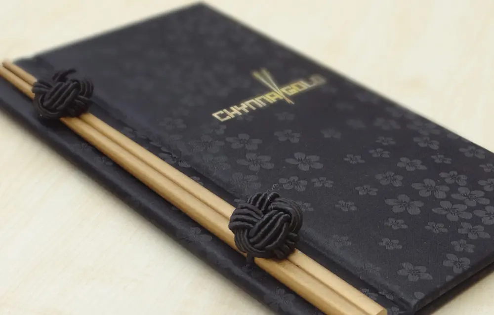Japanese chopsticks in a black book.