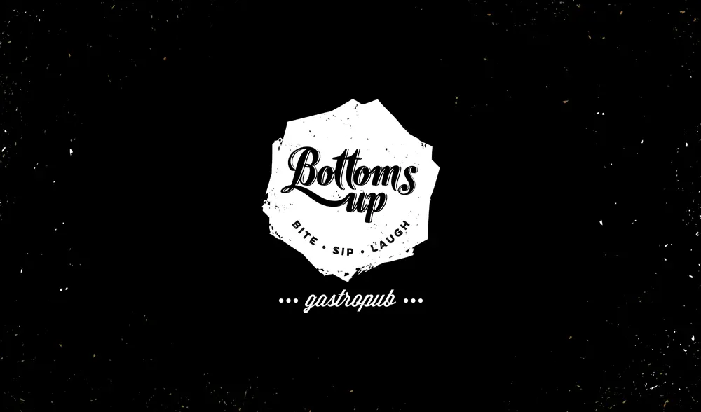 A black and white logo with the words'bottoms up'.