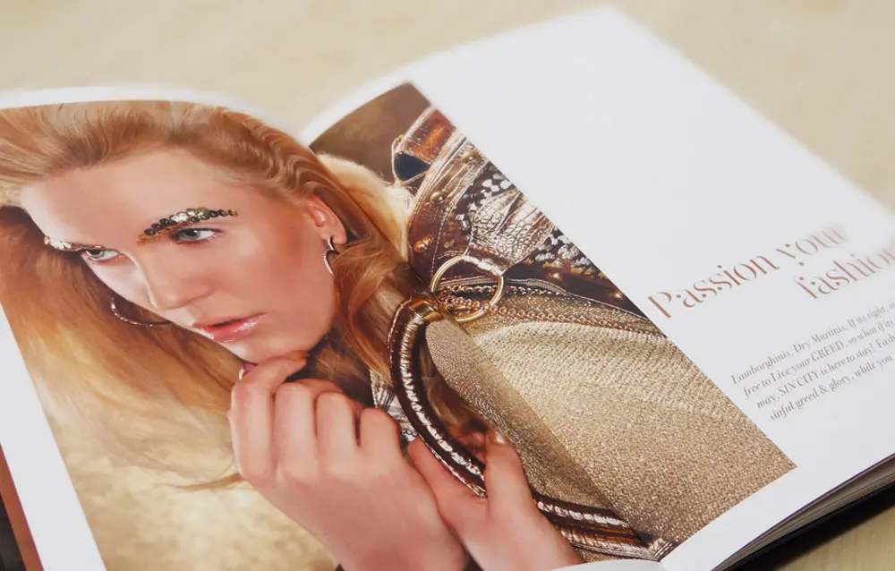 A fashion book with a woman's photo on the cover.